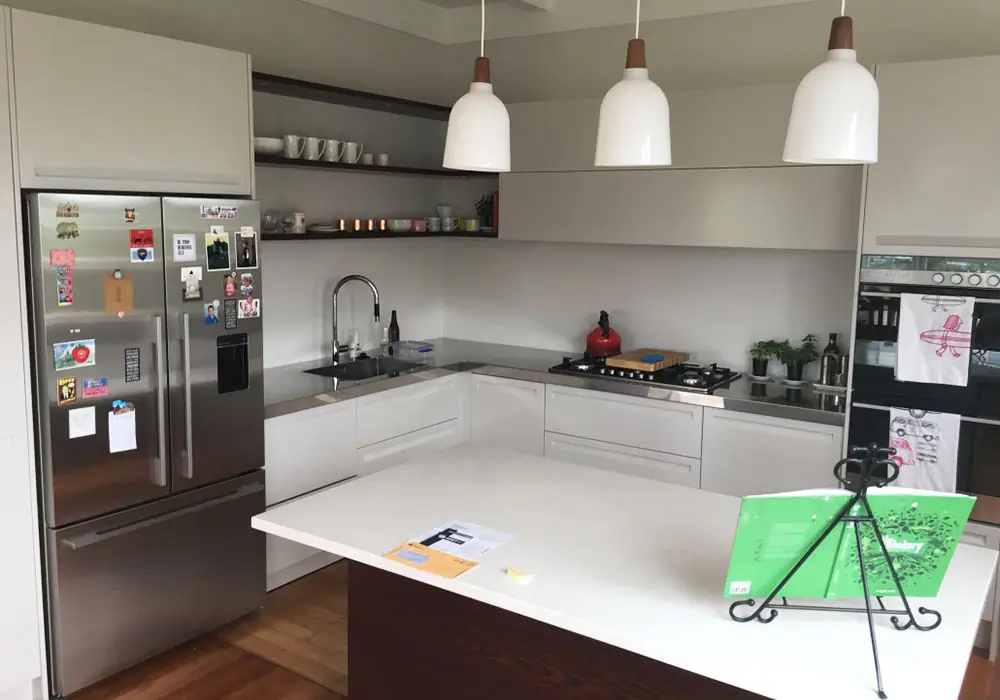 Renovated white kitchen with pendant lights