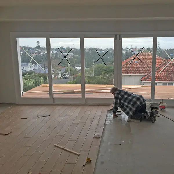 Birkenhead 1950s state house during renovation, with timber flooring being laid in the living area