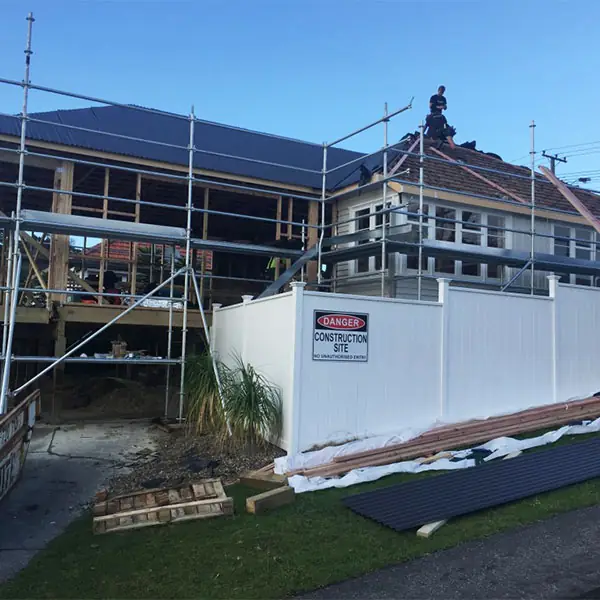 Birkenhead 1950s state house under scaffolding during renovation and extension