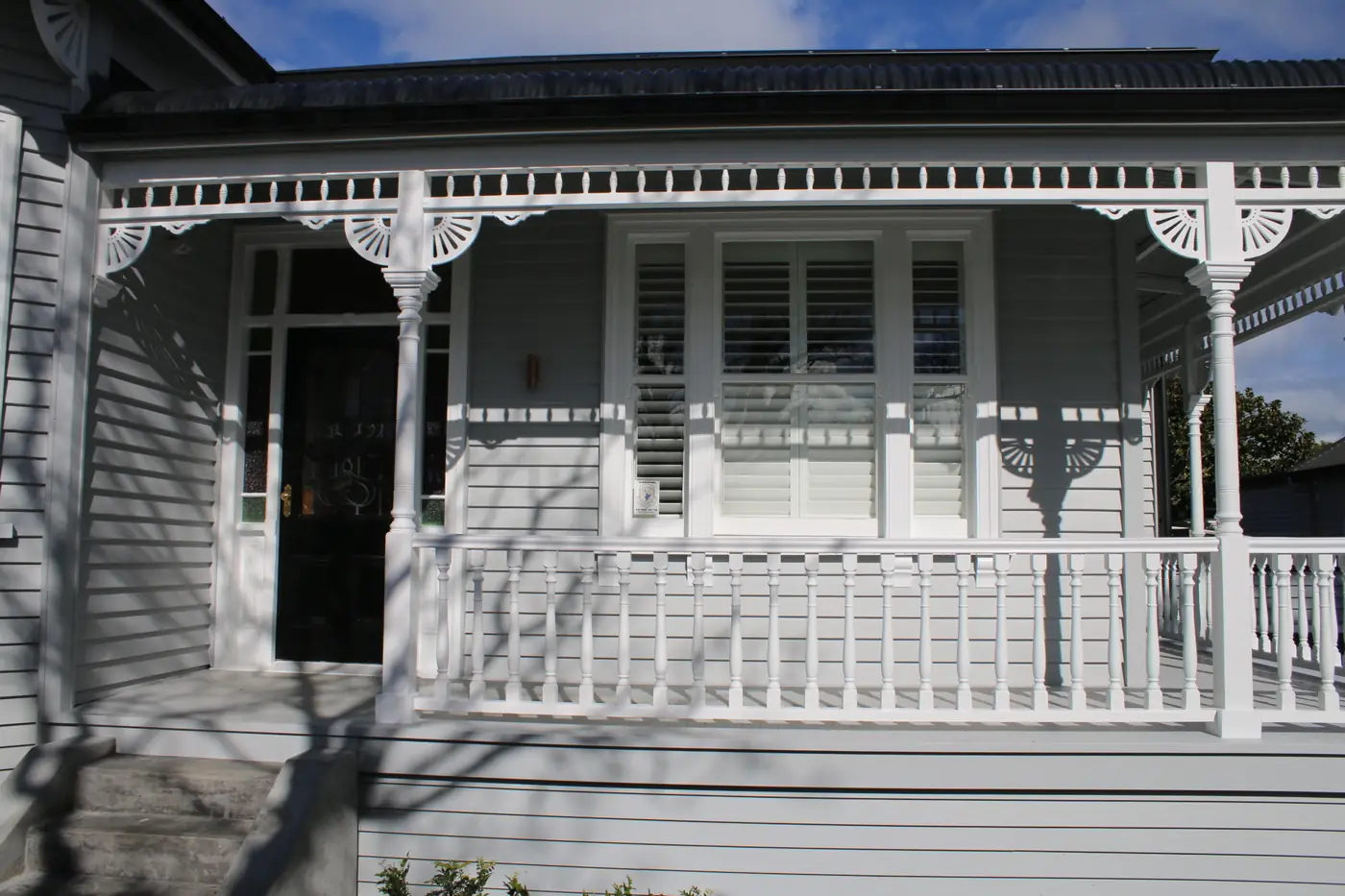 Restored verandah with turned balusters and fretwork on a Mt Eden villa