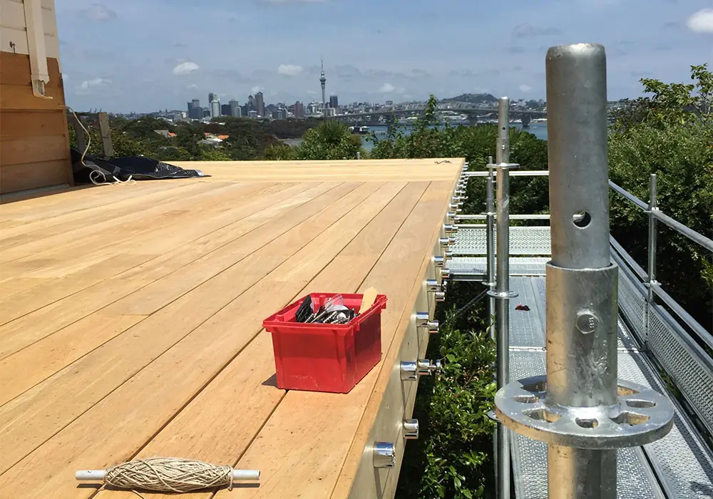 Vitex hardwood decking laid at Northcote Point, with the Auckland city skyline beyond