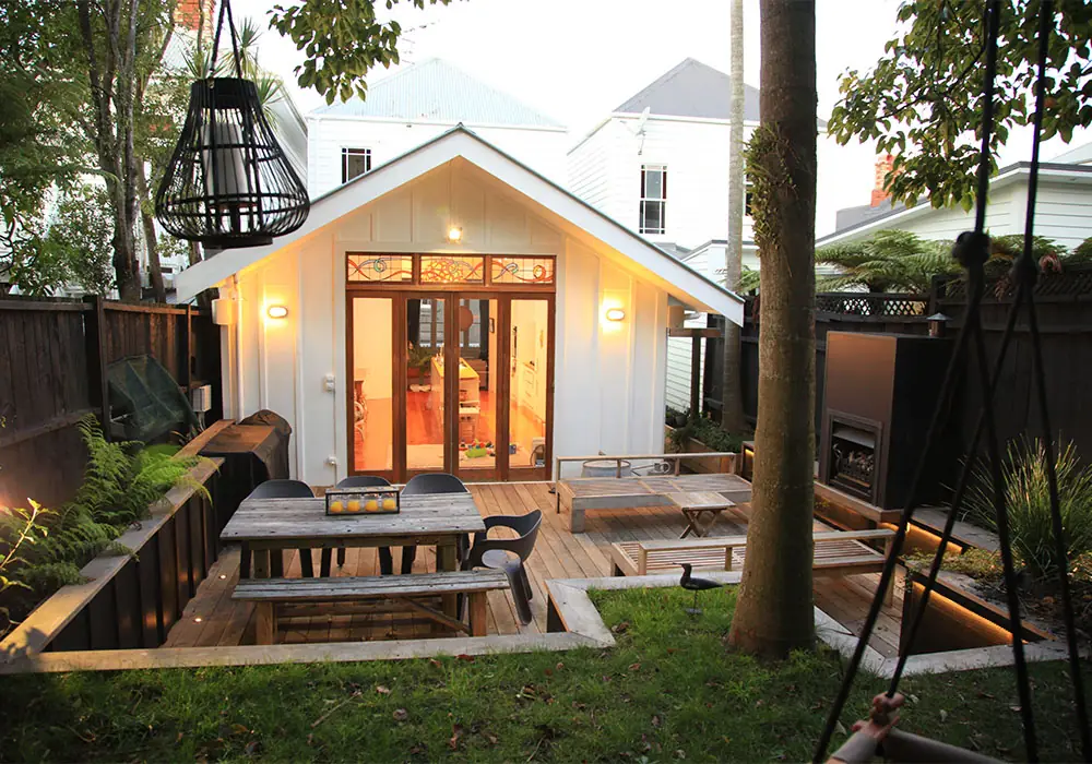 Ponsonby deck after, with Vitex hardwood and steel gas fireplace