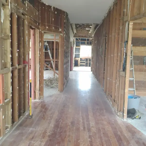 Before: Remuera bungalow hallway stripped to the studs